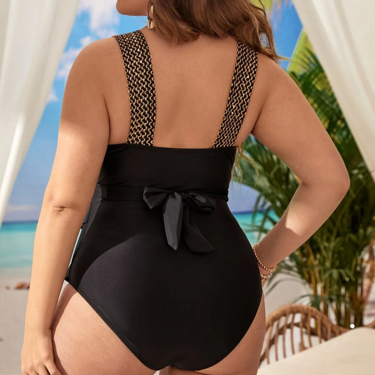 Women's black one-piece sleeveless swimsuit with chest pads on a mannequin.