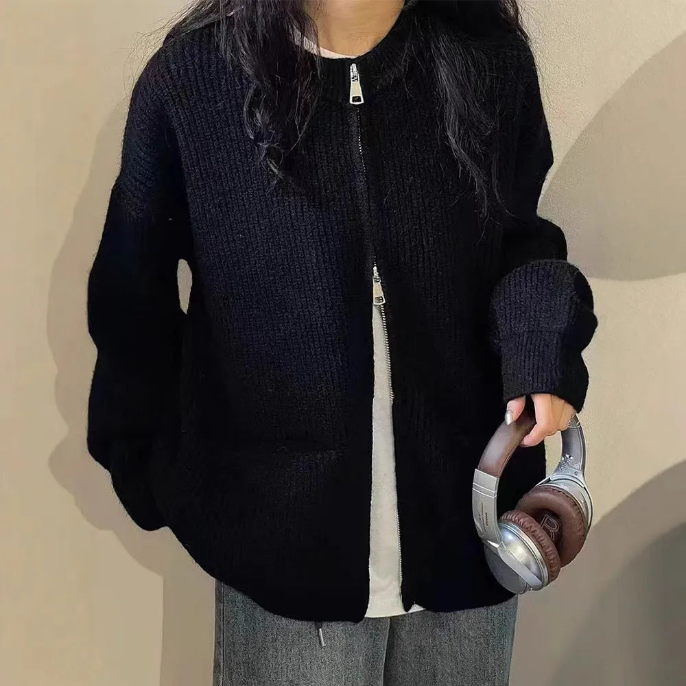 Beige viscose fibre sweater coat cardigan with long sleeves laid flat.