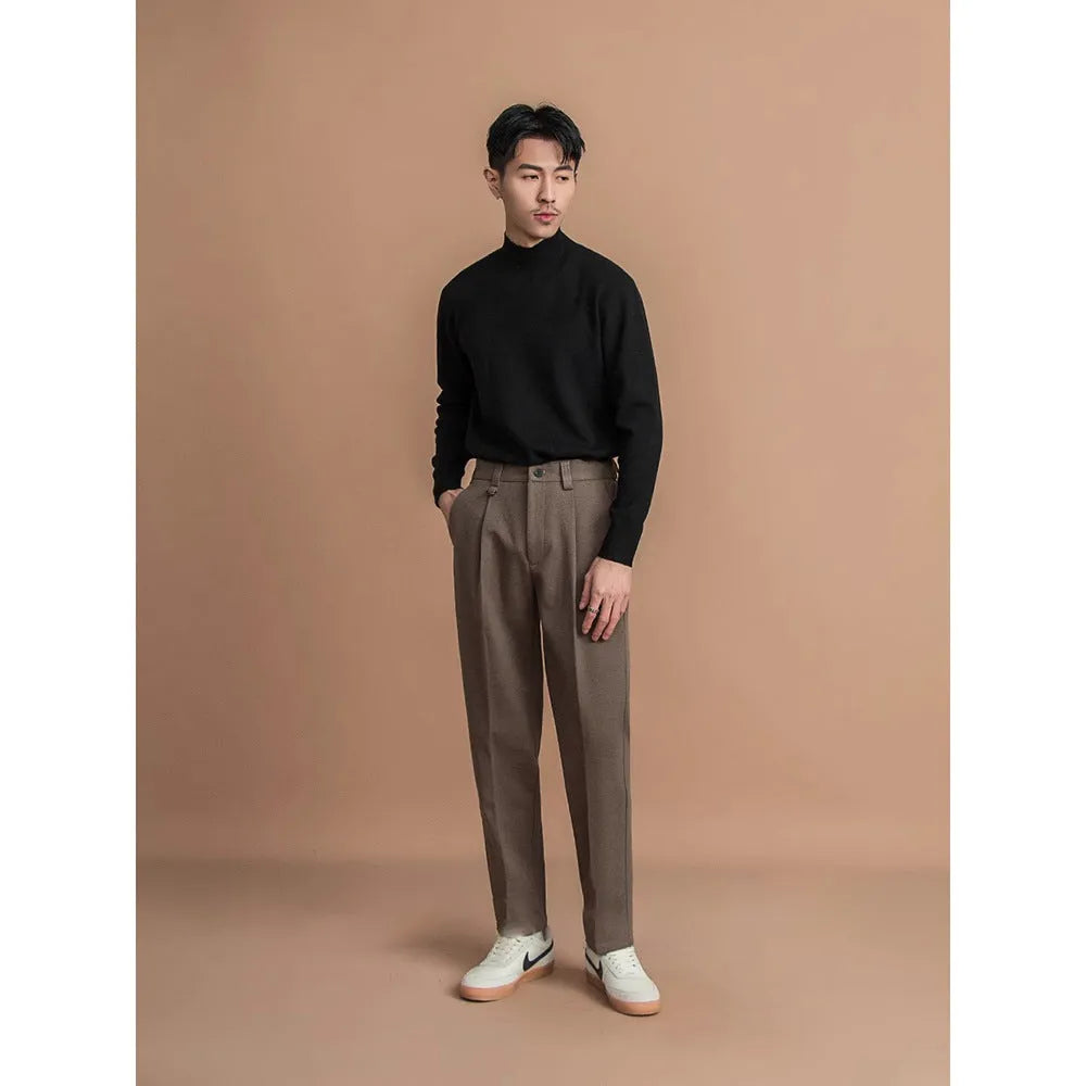 Men's straight-leg trousers in khaki colour on a hanger