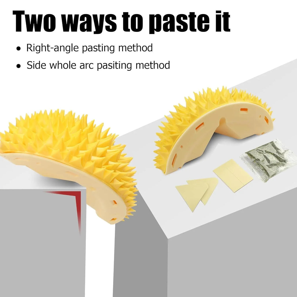 Yellow durian-shaped cat corner scratcher and grooming comb mounted on a wall.