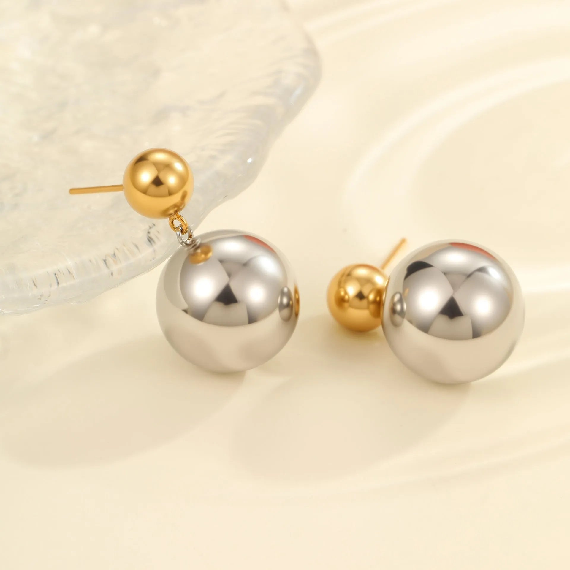 Stainless steel ear studs with colour-block electroplated finish and geometric round bead design