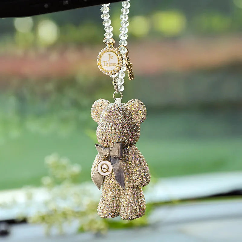 Diamond-embedded Violent Bear car rearview mirror pendant in black, white, and mixed pastel colours.
