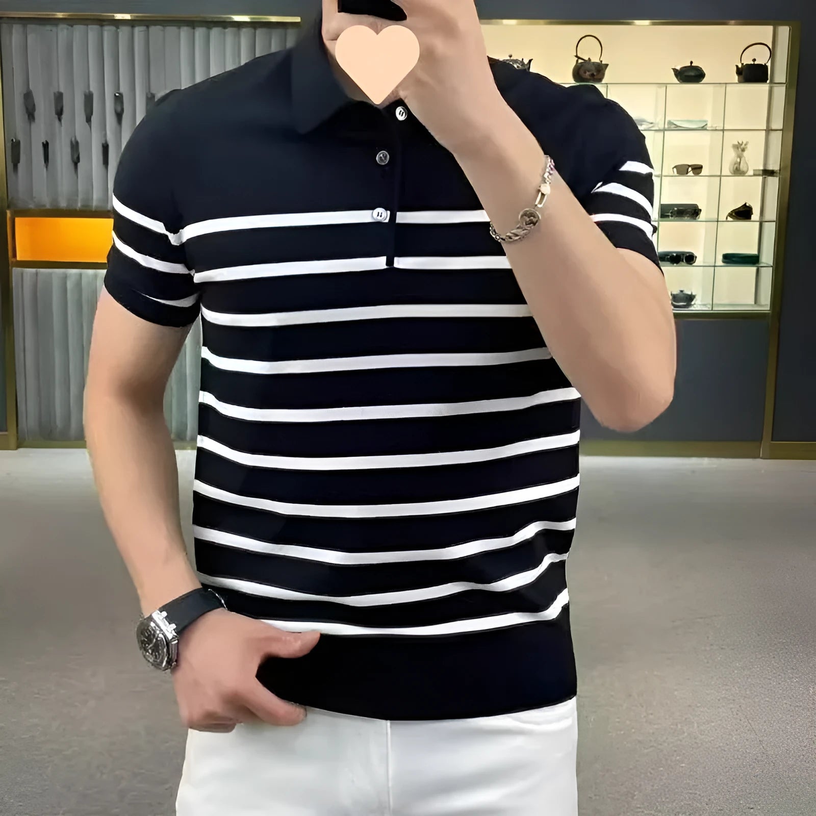 Black and white striped men's knitted t-shirt with a pointed lapel collar.