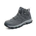 Men's black flannel high-top hiking sneakers with rubber sole and lace-up front on a rocky path.