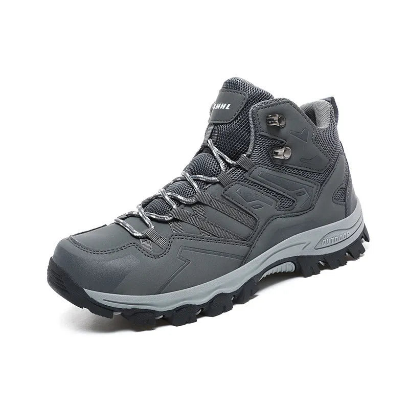 Men's black flannel high-top hiking sneakers with rubber sole and lace-up front on a rocky path.