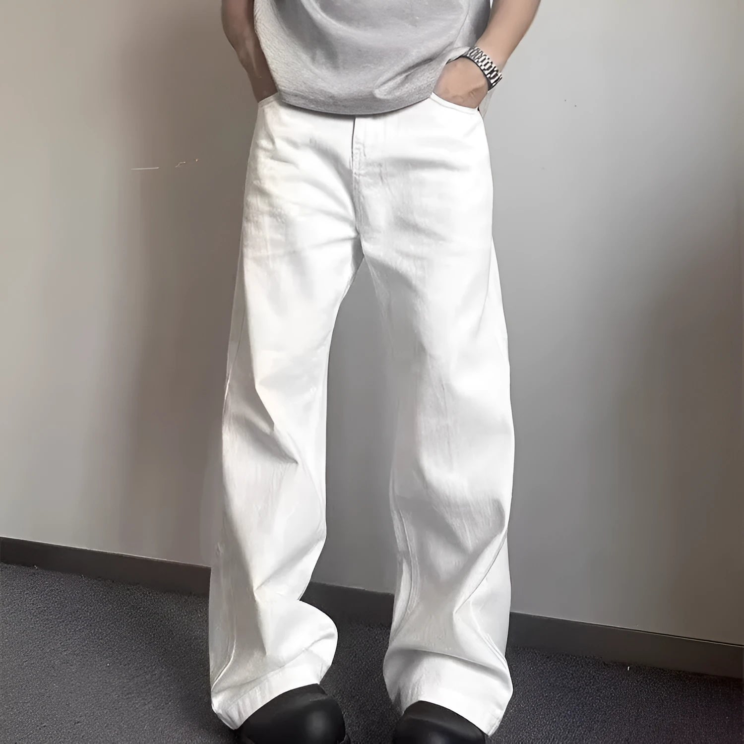 Men's white straight-leg jeans with loose fit and wide leg opening