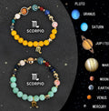 Set of two natural stone bead bracelets with elastic cords, each representing a different zodiac sign.