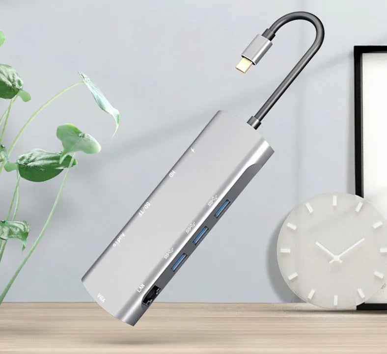 Grey USB-C docking station with aluminium alloy shell and 140mm cable showing HDMI and VGA ports