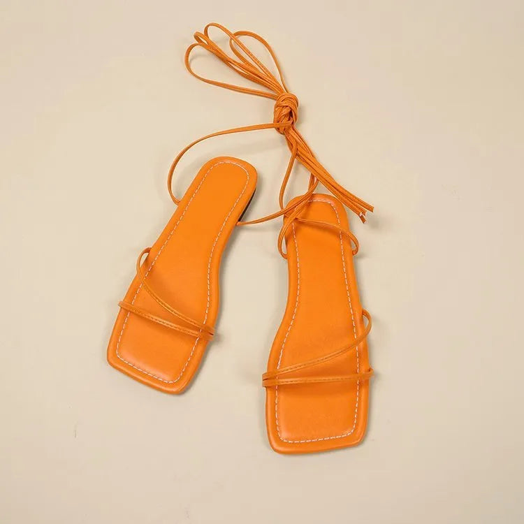 Women's flat sandals with ankle bandage detail and front lace-up in three colour options