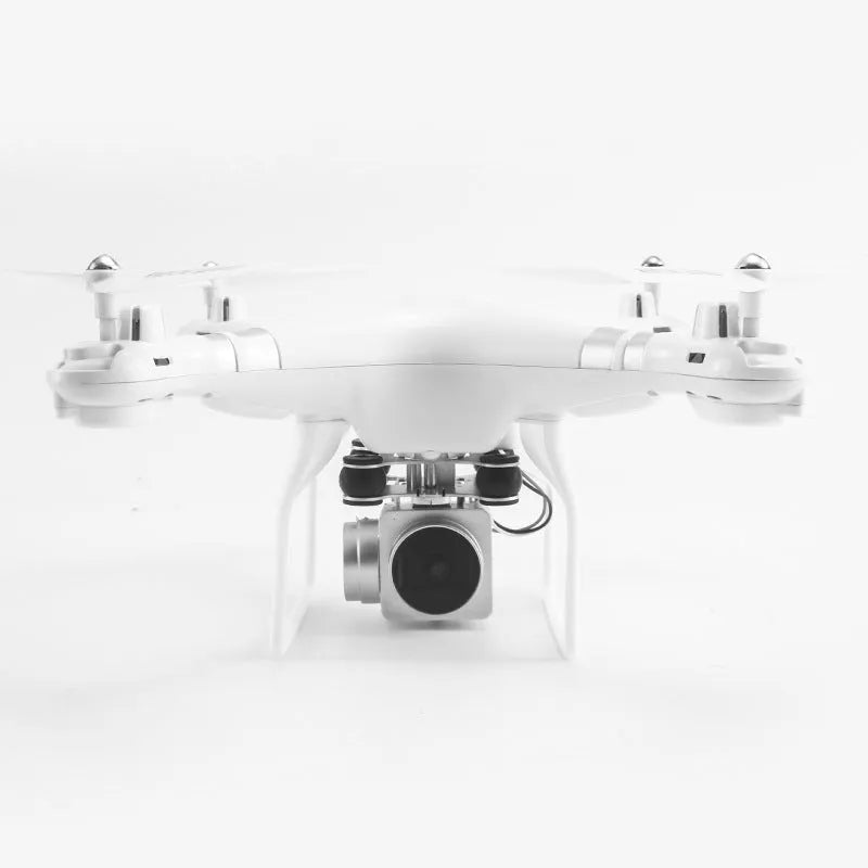 Black HD aerial photography drone with alloy frame and remote control handle on a table