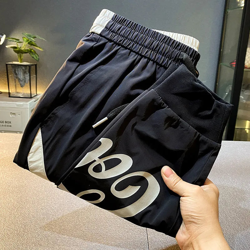 Men's solid black ultra-thin ice silk ankle banded cropped casual trousers