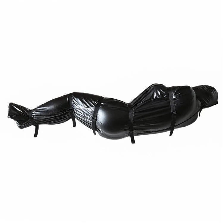 Black patent leather bondage outfit with six ratchet tie down straps