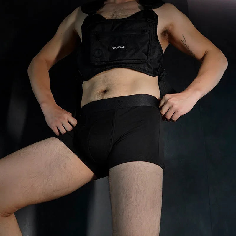 Men's solid colour cotton boxer shorts in black, shown flat