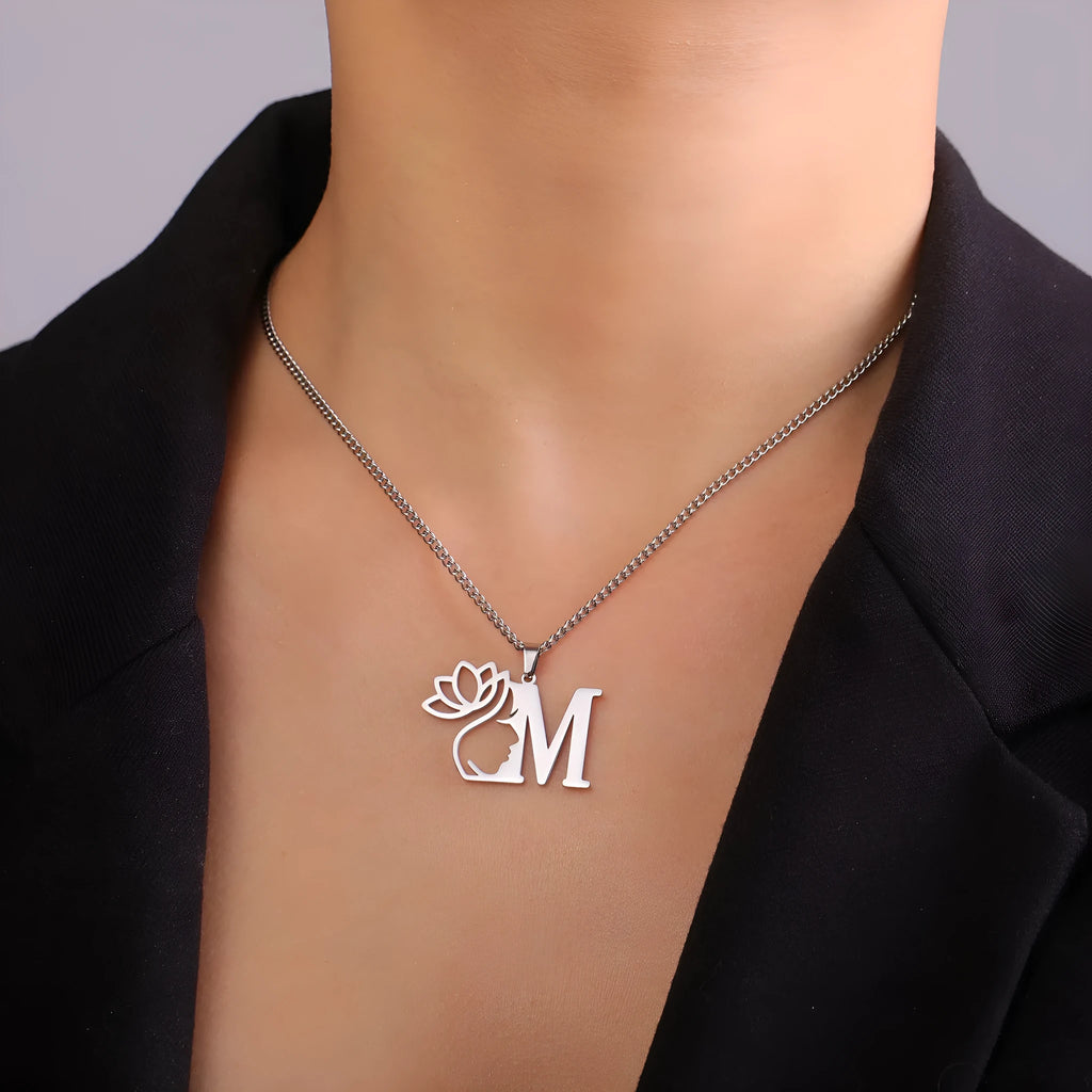 Stainless steel fashion necklace with cross chain design and electroplated gold finish including pendant