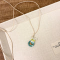 Women's coloured glaze skirt pendant necklace with joker design on cotton linen chain
