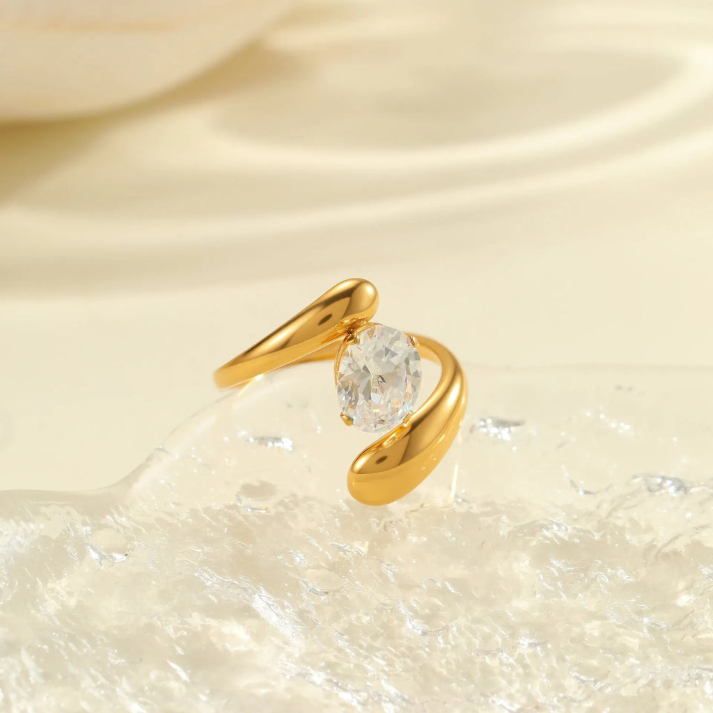 Open mouth geometric zircon ring with round, oval and quadrangle elements on stainless steel band