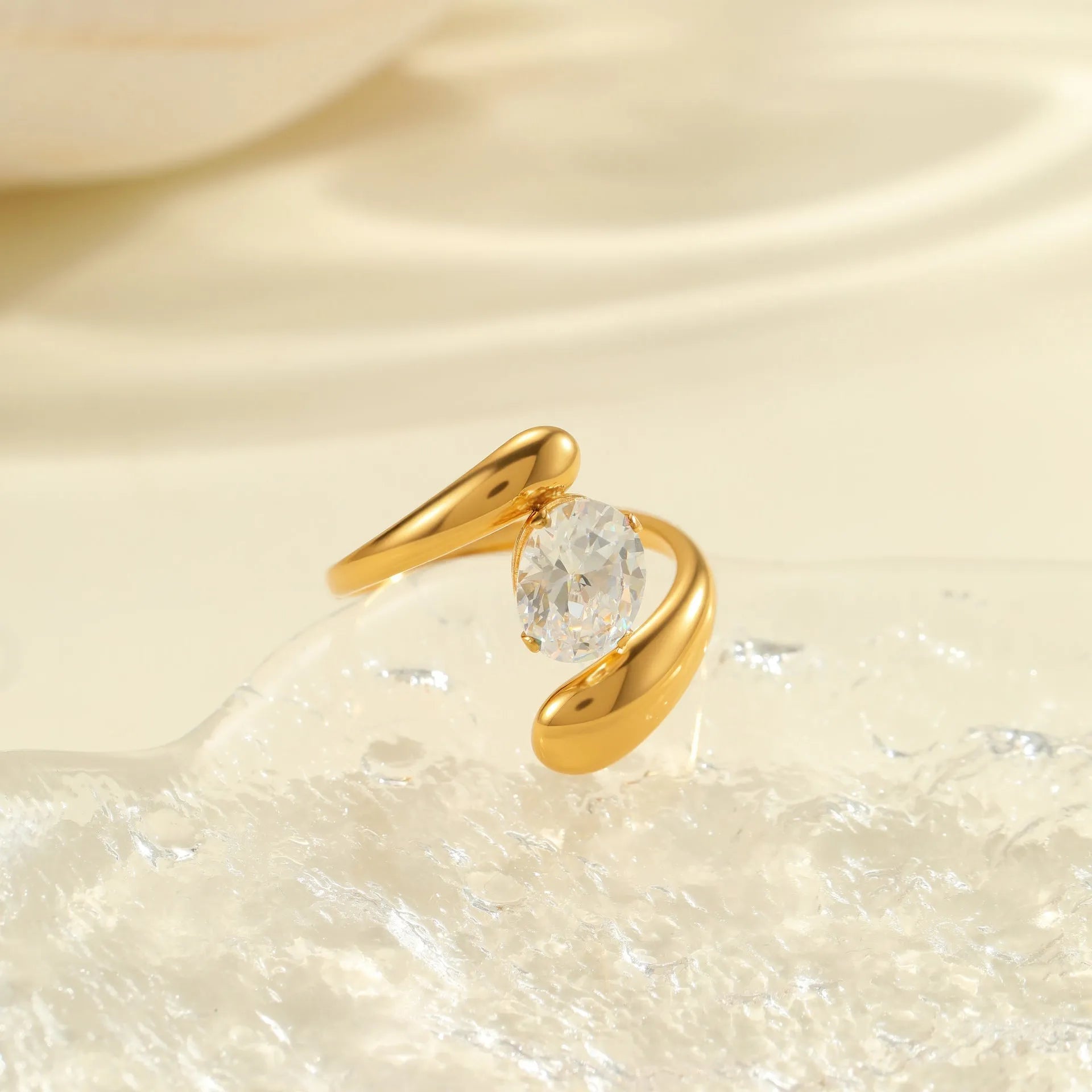 Open mouth geometric zircon ring with round, oval and quadrangle elements on stainless steel band