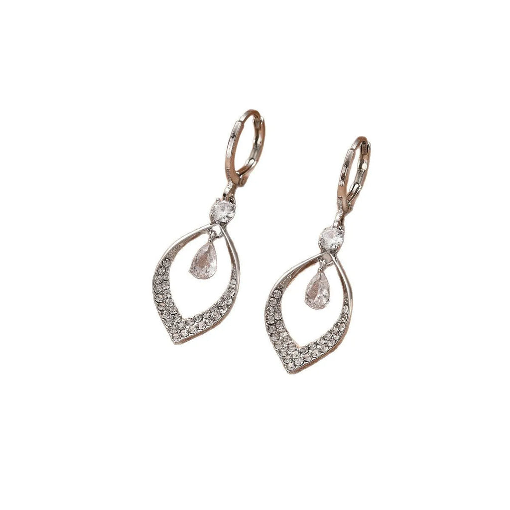A pair of women's zircon teardrop tassel earrings with gold metal buckles on a white background.