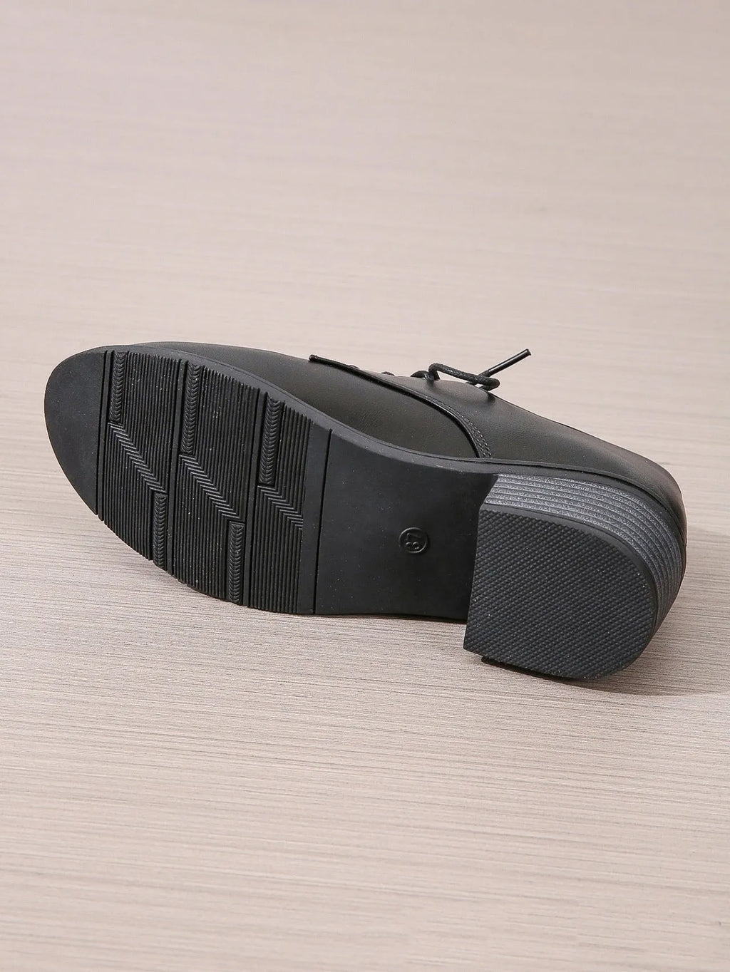 Black women's low-top work shoes with a thick chunky rubber heel and a PU leather upper