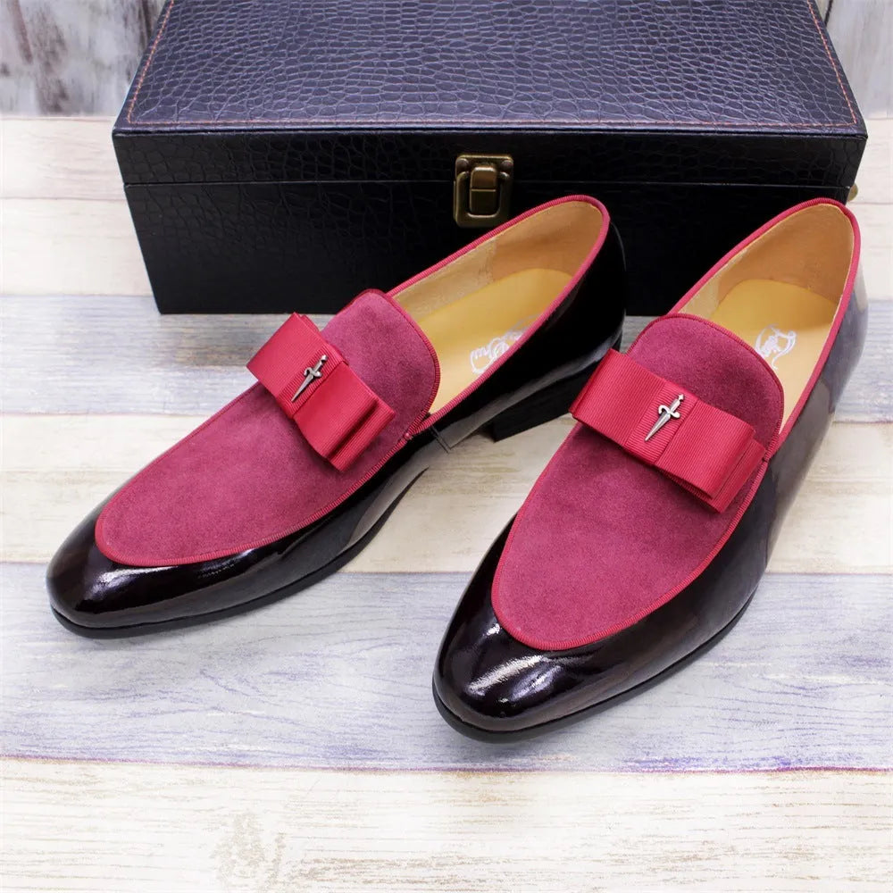 Men's glossy black patent leather low-top shoes with a tassel detail on a rubber sole.