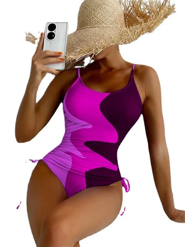 Blue sleeveless one-piece swimsuit with a backless, tight-fitting design on a mannequin.