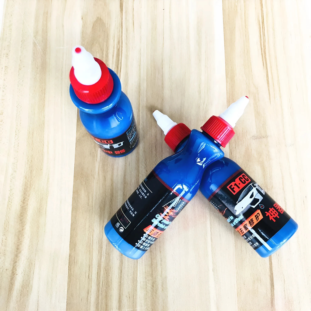 Blue car scratch repair kit with applicator tool for automotive paint touch-ups