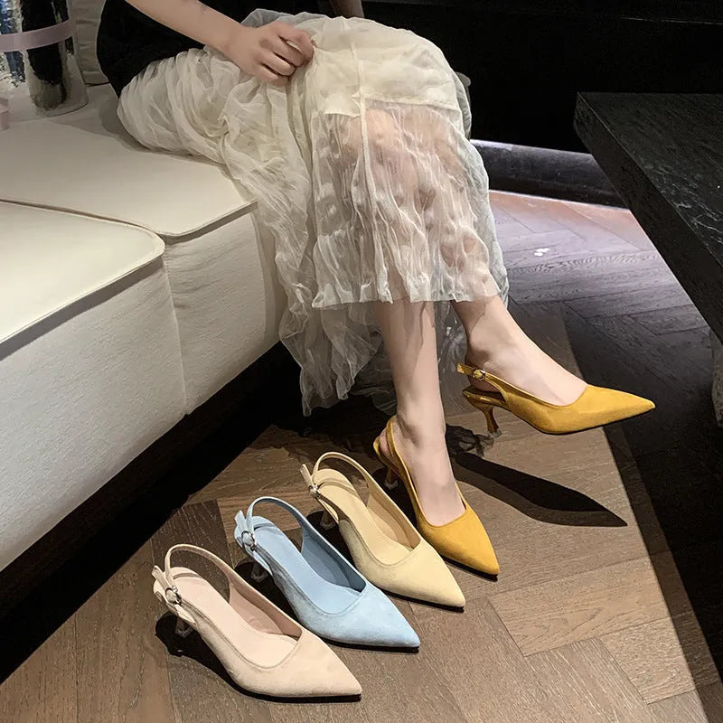 A pair of apricot-coloured suede pointed-toe stiletto high heels with a rubber sole.