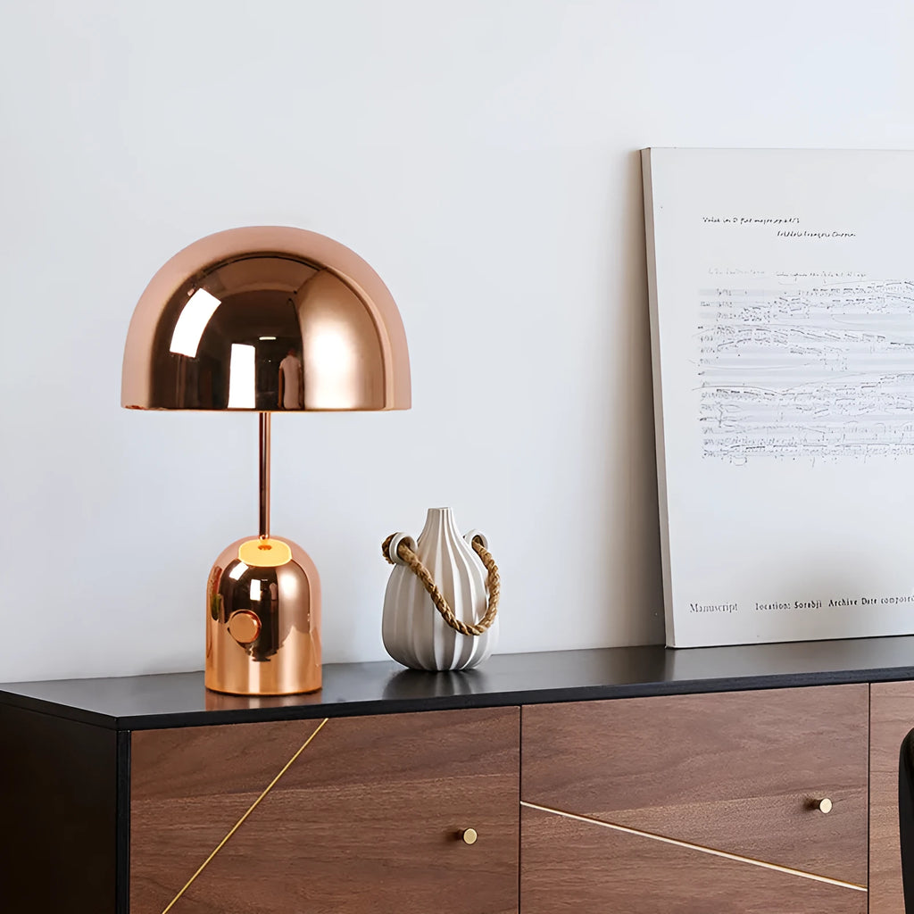 Mushroom table lamp with metal base in Rose Gold finish on wooden table