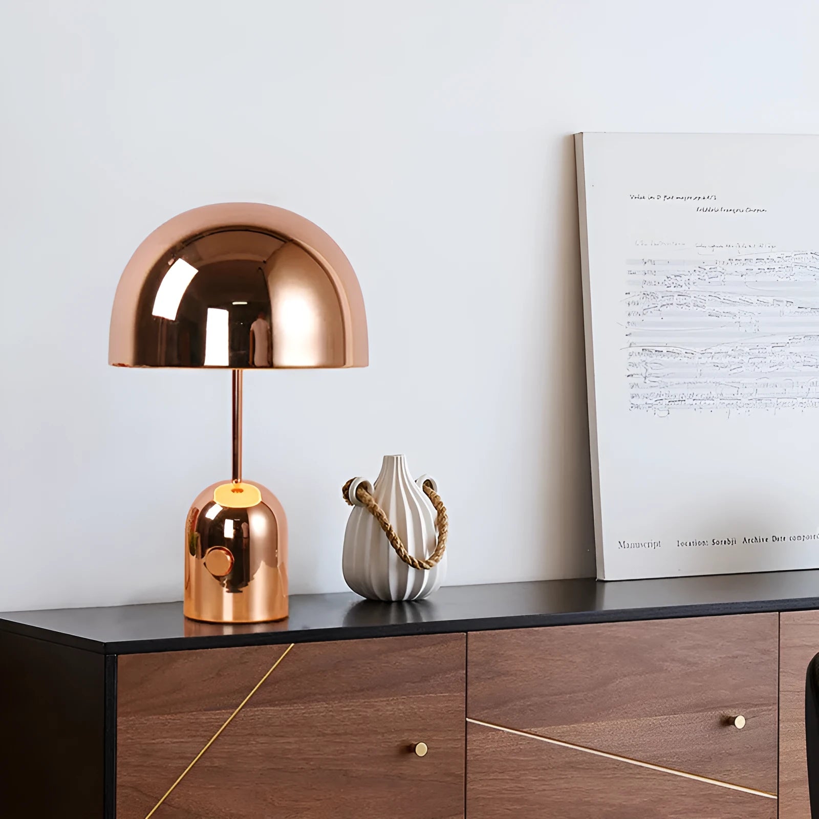 Mushroom table lamp with metal base in Rose Gold finish on wooden table