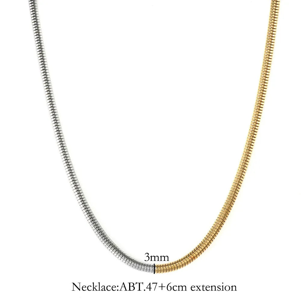 Women's stainless steel snake bone chain necklace with gold finish and geometric line detailing