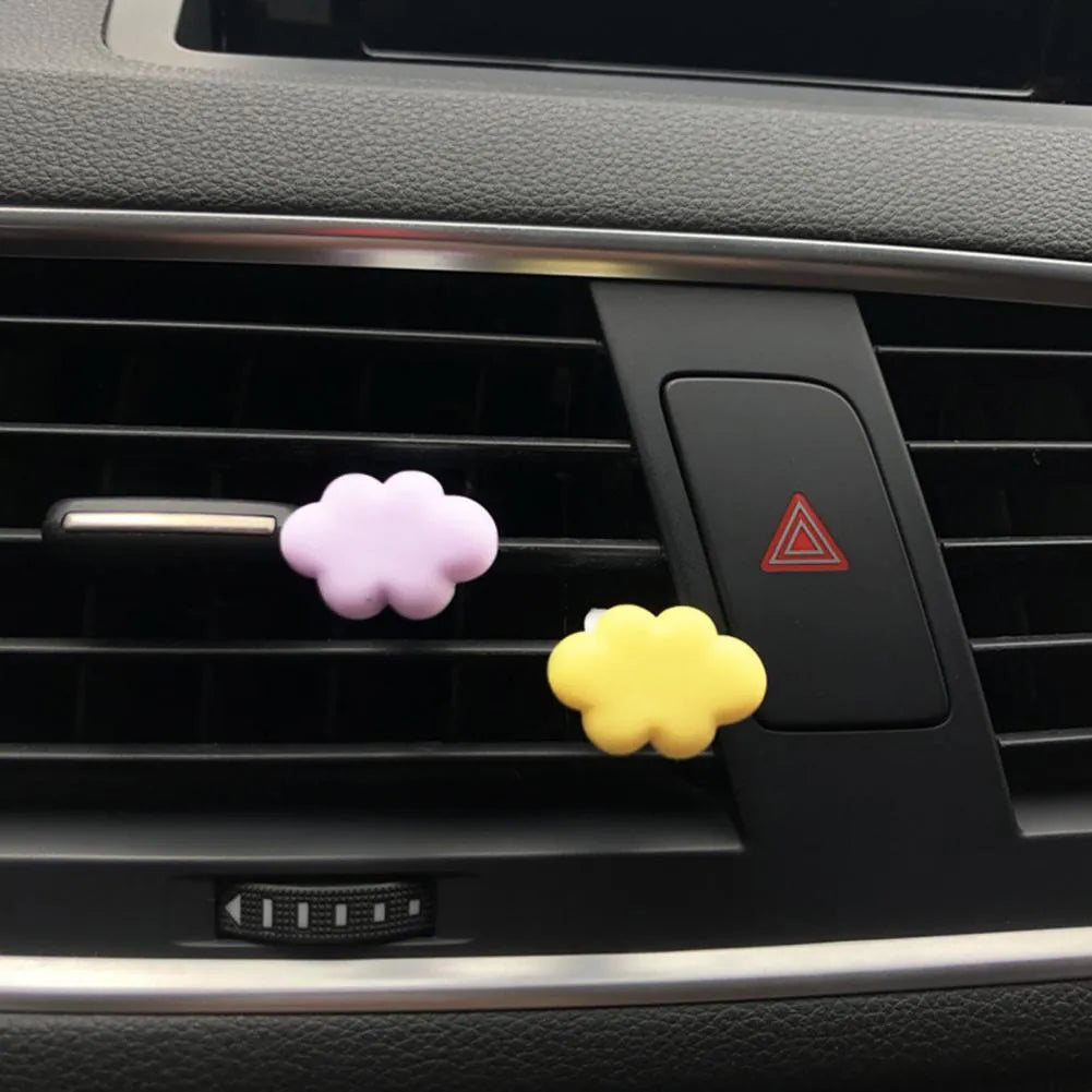 Resin Baiyun cartoon character car air vent fragrance clip in assorted colours.