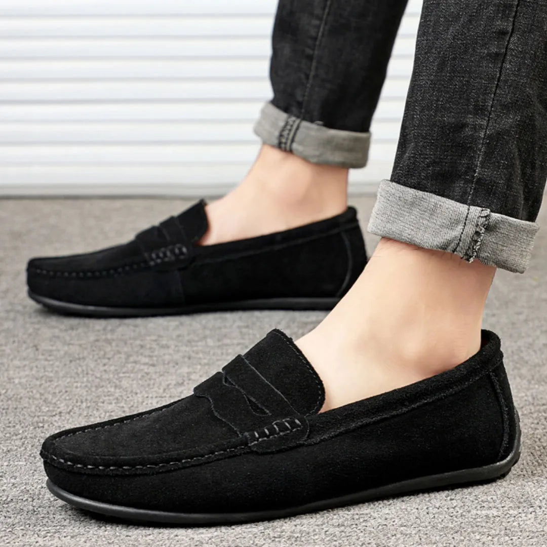 Men's brown suede loafers with round toe and flat rubber sole