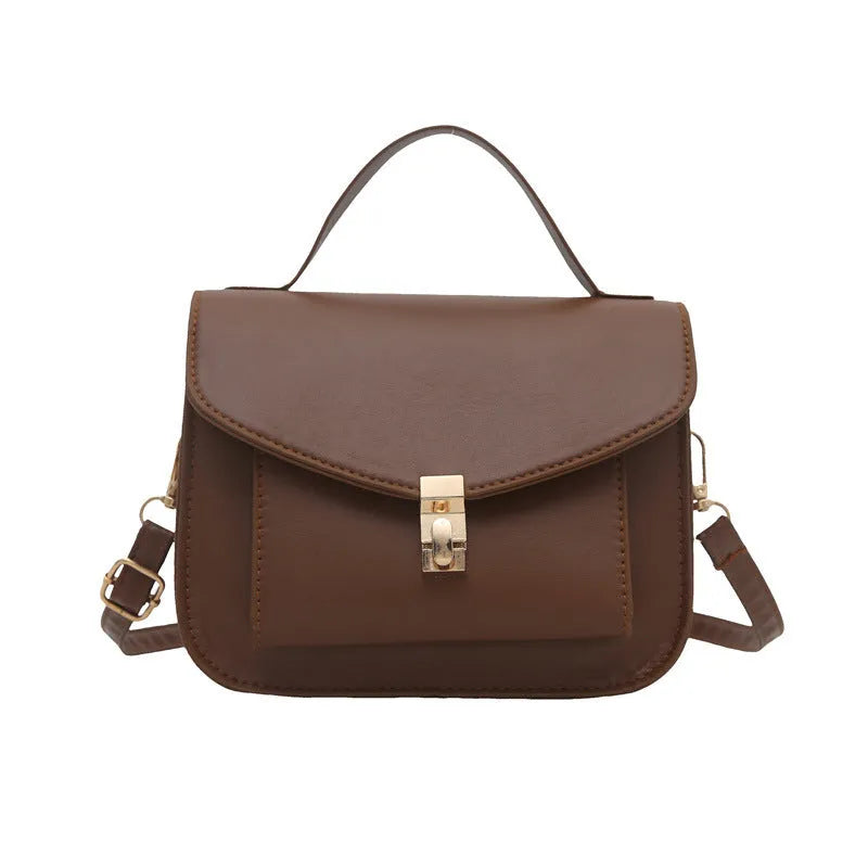 PU leather messenger bag in horizontal square shape with crossbody strap and document compartment