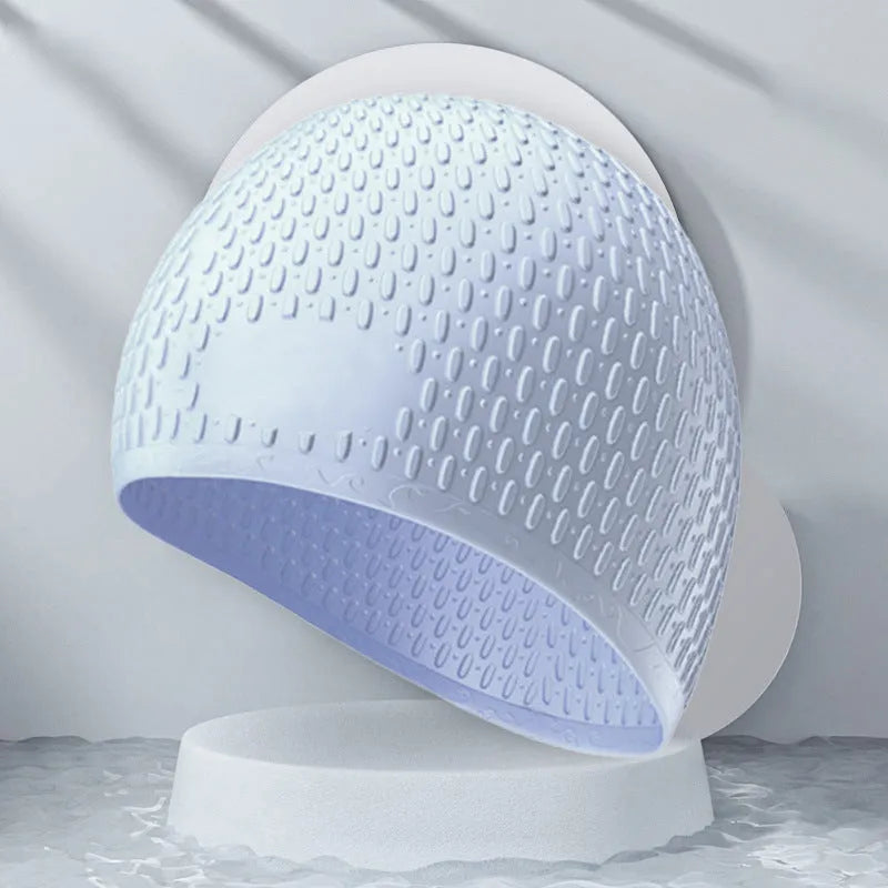 Silicone swimming cap for adults in various solid colours on a white background.