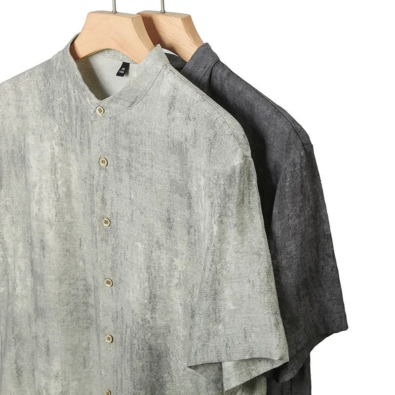 Men's loose fit linen shirt in solid colour with stand collar, shown in black grey.