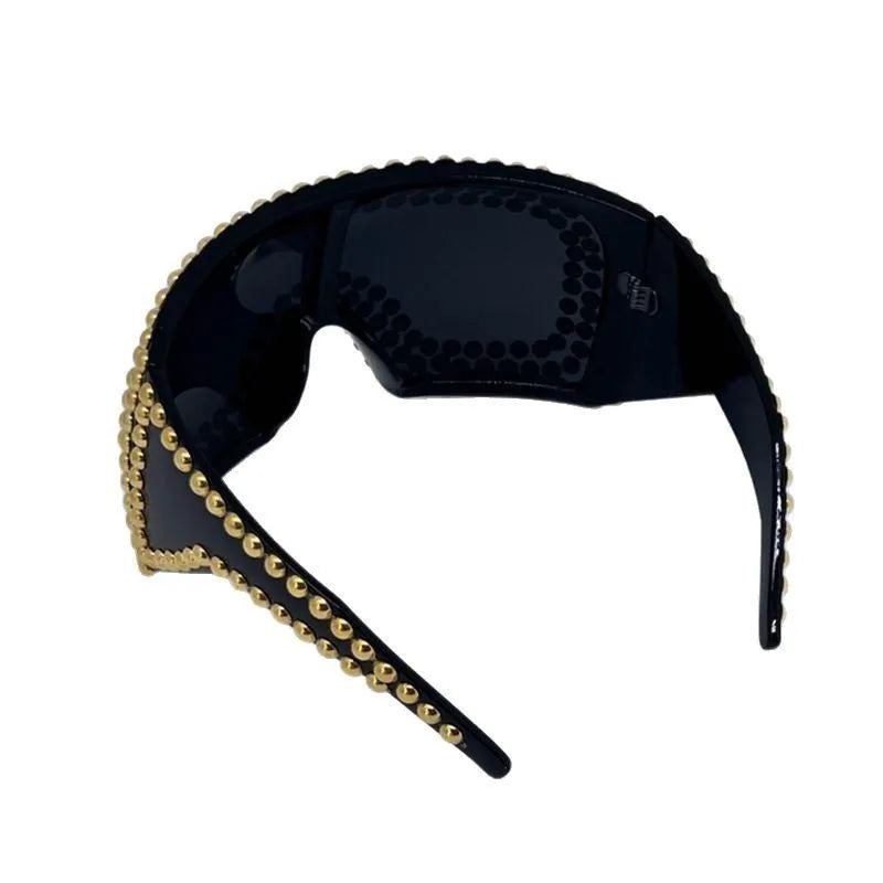 Men's punk style square sunglasses with large rims and rivet detailing in silver colour