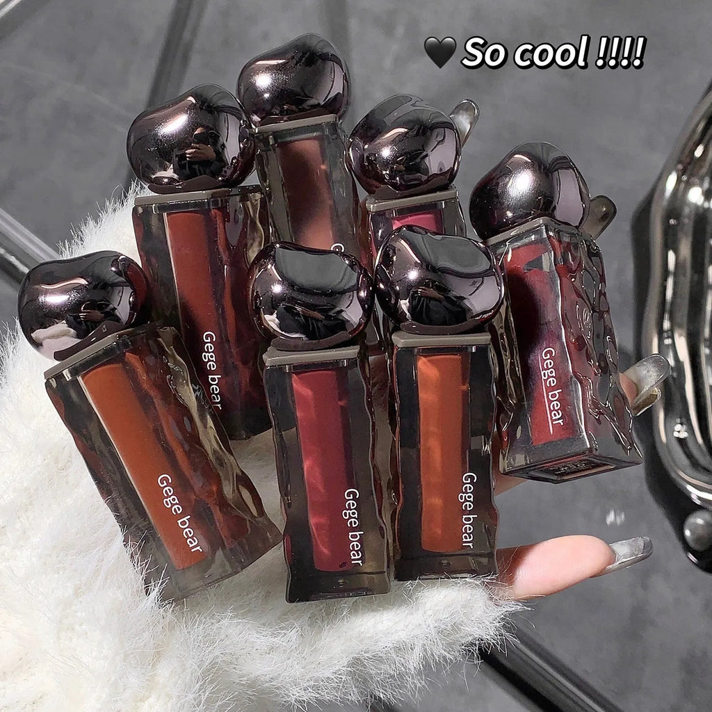 Glacier Lava Lip Lacquer set showing seven sheer glossy shades with built-in mirror