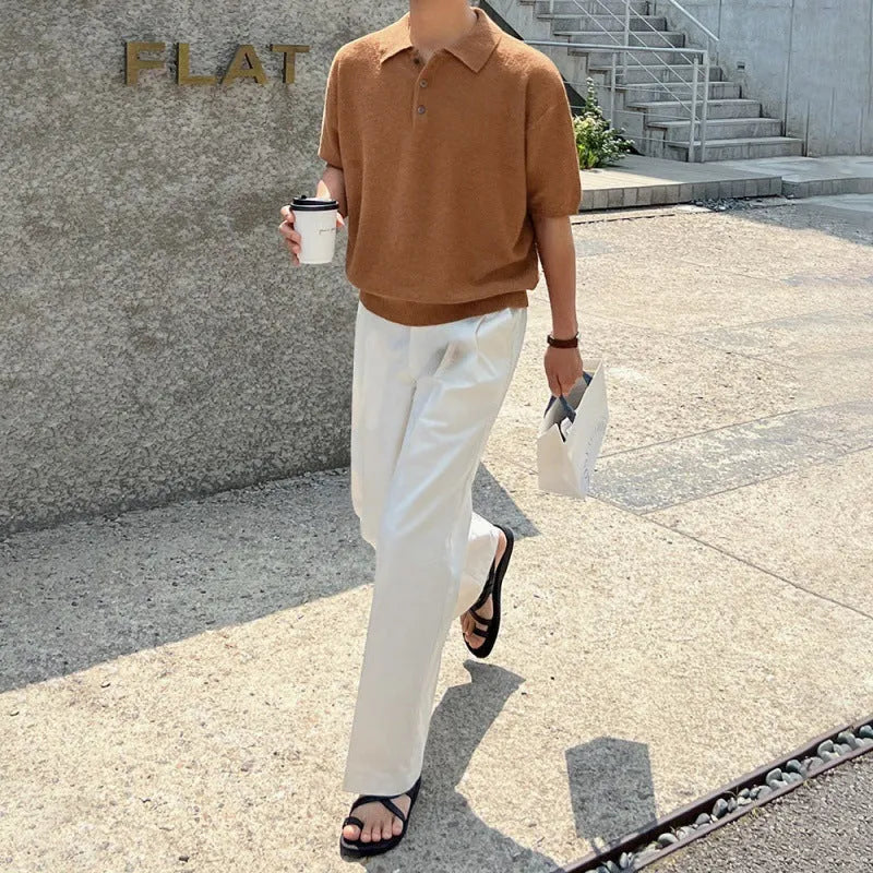 Man wearing a caramel-coloured retro knitted polo shirt with short sleeves and an asymmetric design detail.