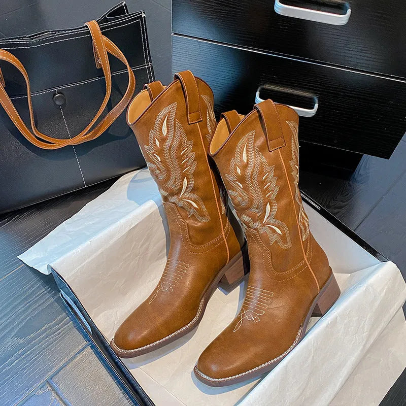 Brown embroidered women's mid-calf Martin boots on a waterproof platform with a square heel.