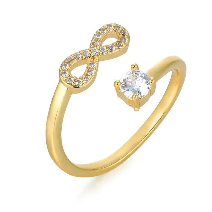 Geometric diamond-cut letter ring with zircon inlay, shown in gold, rose gold, and silver.