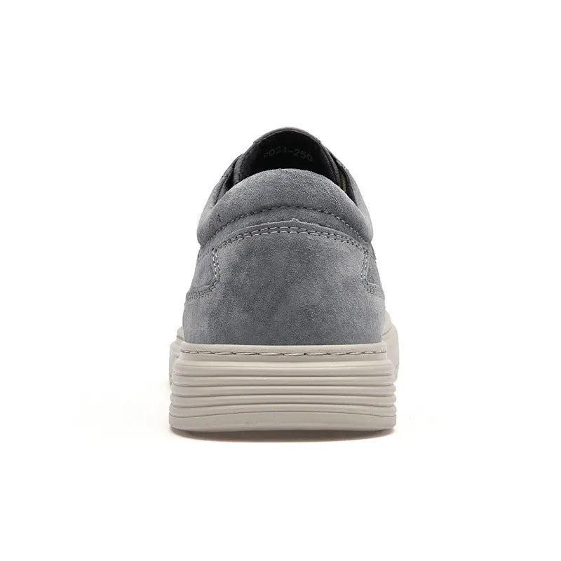 Men's grey casual leather skate shoes with round toe and low-top design on a rubber sole.
