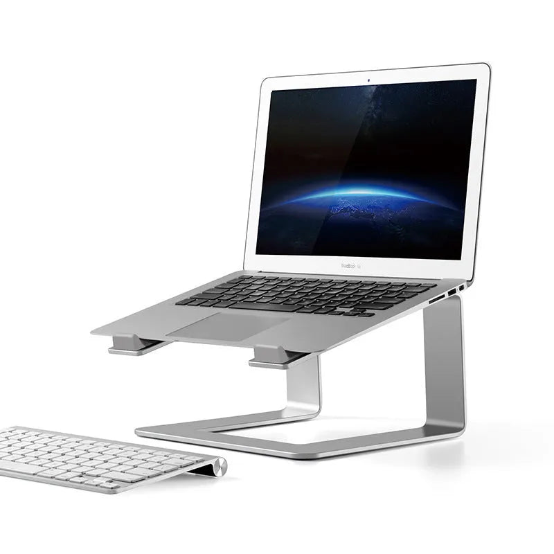 Black aluminium alloy laptop stand folded on desk next to silver version