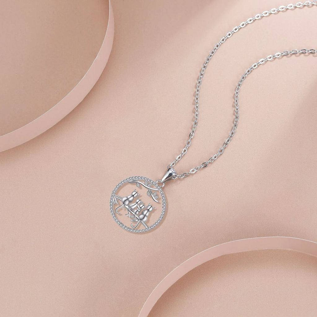 Women's copper necklace with four kitten pendant design and cross chain