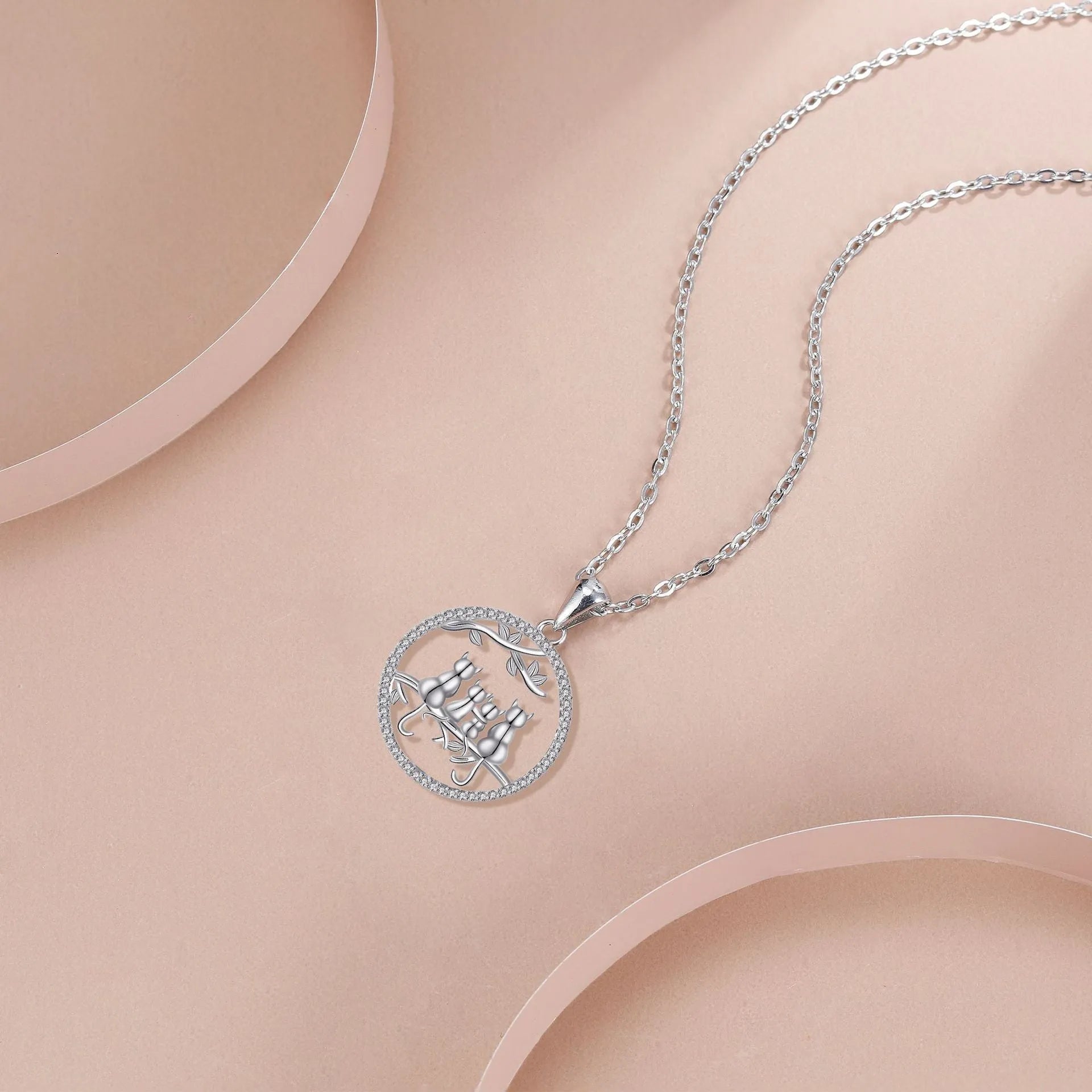 Women's copper necklace with four kitten pendant design and cross chain