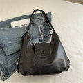 Textured PU leather women's single shoulder bag in horizontal square shape with optional pendant detail