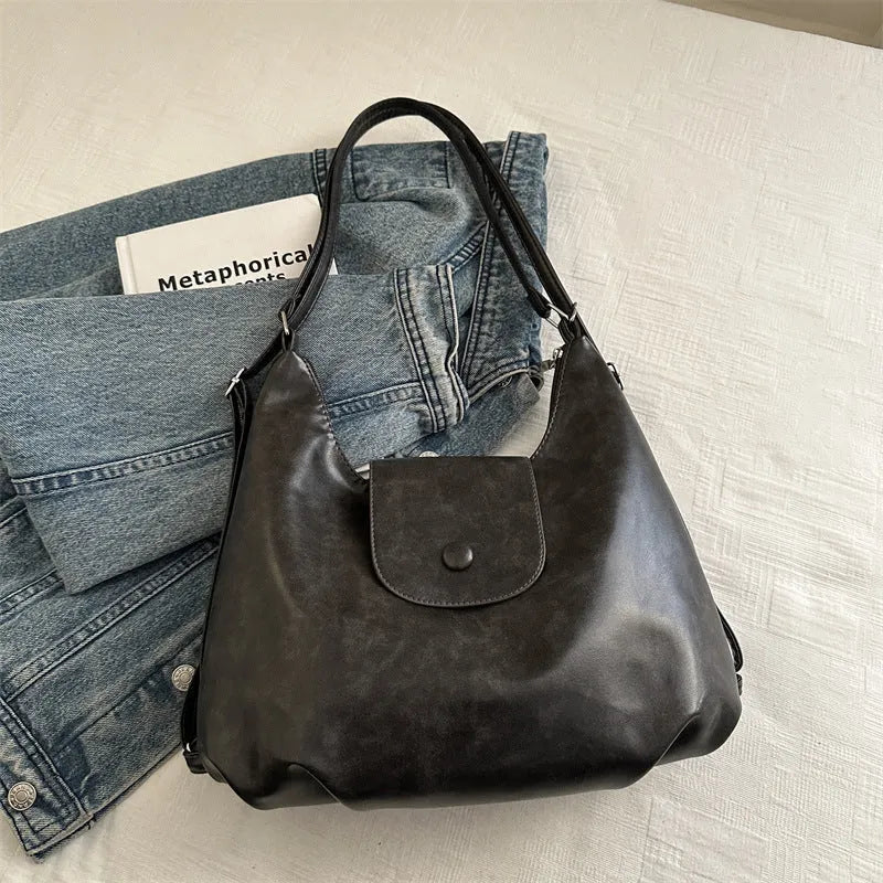 Textured PU leather women's single shoulder bag in horizontal square shape with optional pendant detail
