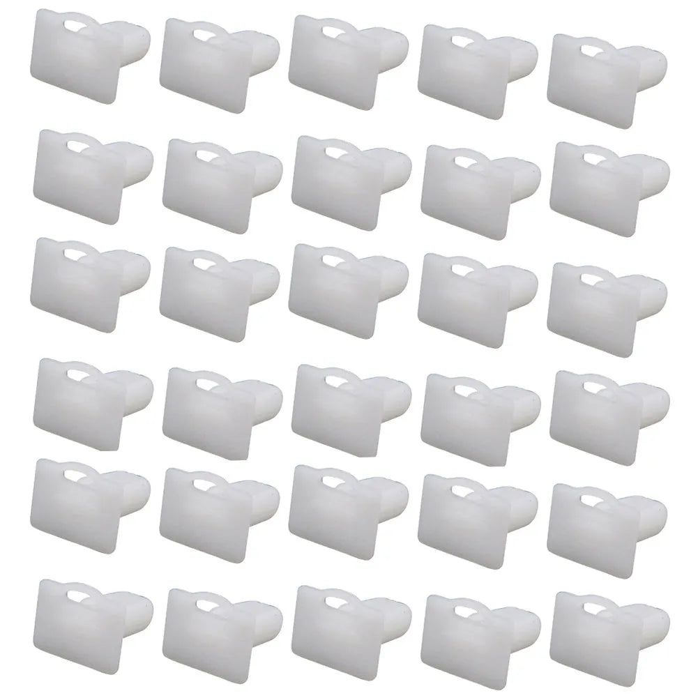 Sixty grey PA66 plastic car interior trim clips arranged on a white surface.