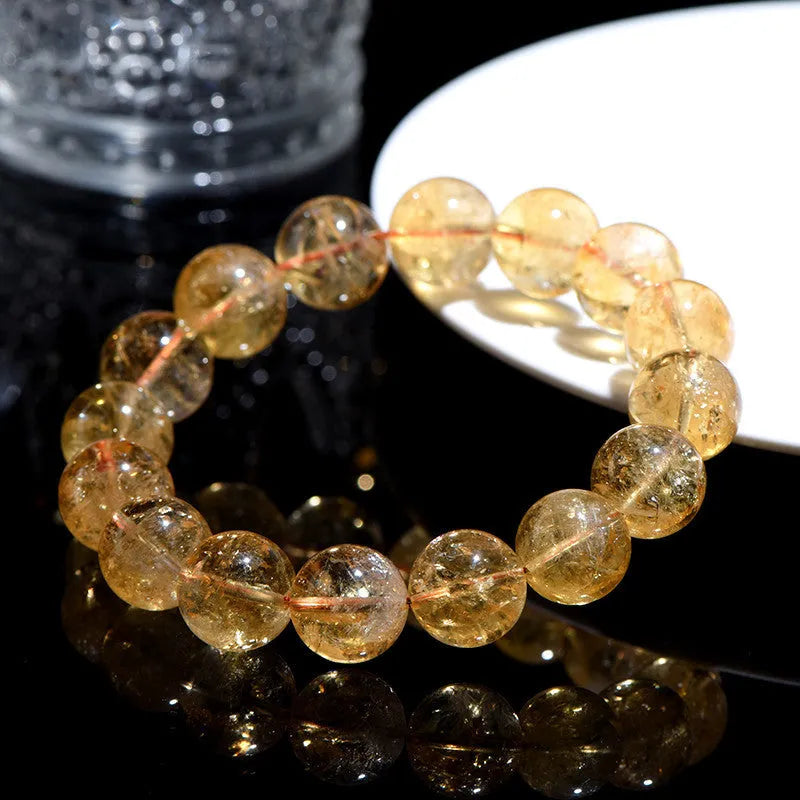 Natural yellow citrine bracelet with geometry-shaped beads in multiple size options on adjustable closure