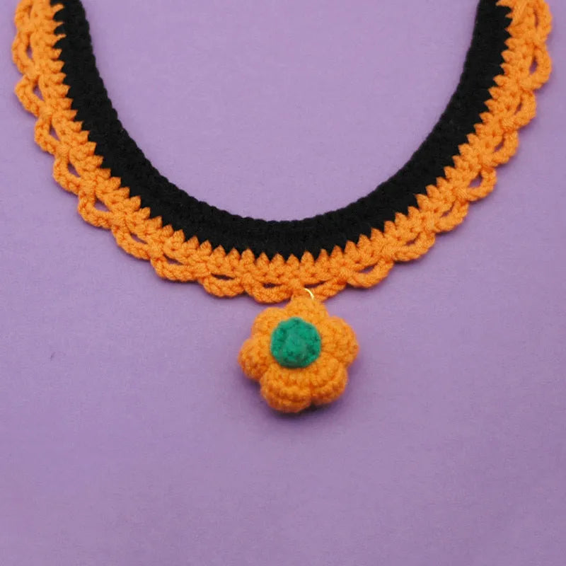Hand-crocheted wool pet collar with pumpkin design for Halloween in adjustable sizes