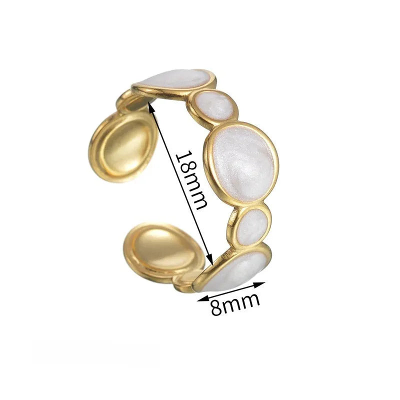 Silver-tone geometric stainless steel ring with an adjustable opening on a plain background.